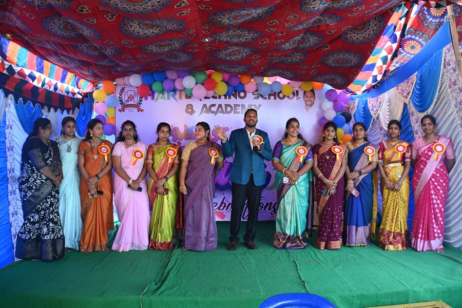 Teachers on stage at a school event