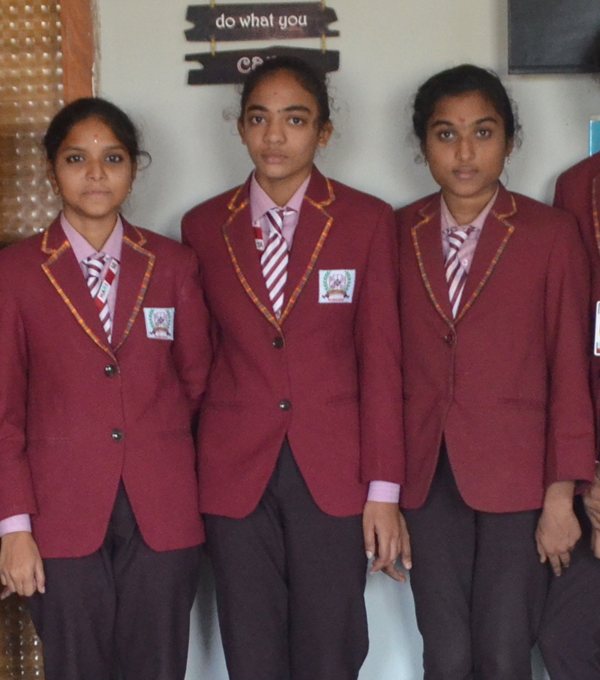 Intermediate college students in uniform blazers